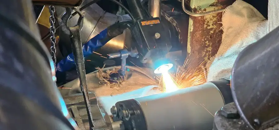 On-site metal spraying repair of a worn shaft